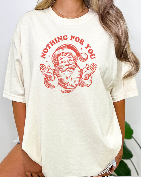 Woman wearing funny retro Santa Clause graphic shirt in natural beige color with the quote "Nothing For You"